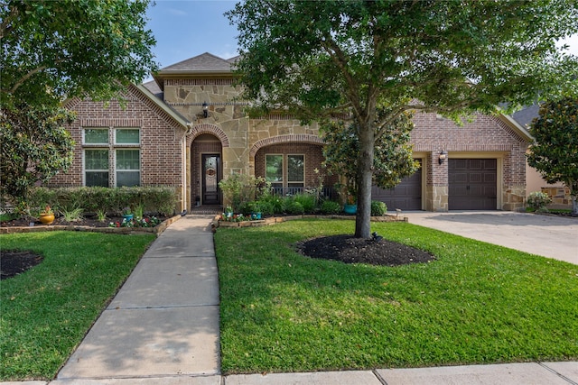 10040 Easton Sky Ln, Cypress, TX 77433 - view of front facade featuring brick siding, stone siding, and a front lawn