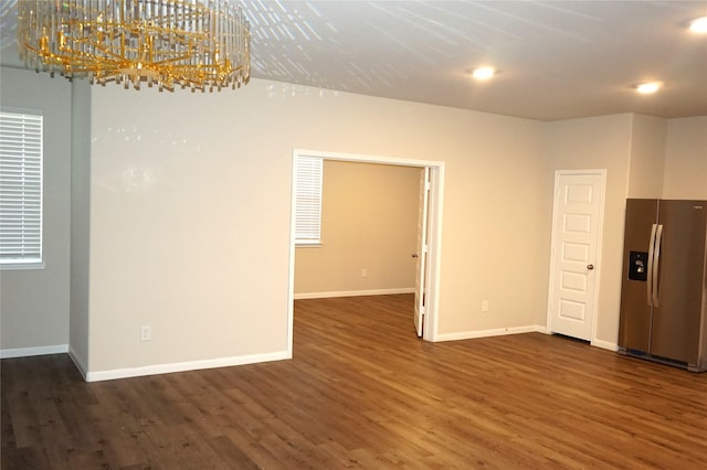 21930 King Heights Ln, Houston, TX 77073 - unfurnished room with a chandelier, dark wood-style floors, baseboards, and recessed lighting