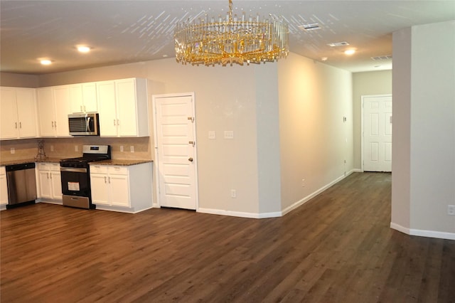 21930 King Heights Ln, Houston, TX 77073 - kitchen featuring appliances with stainless steel finishes, white cabinetry, decorative backsplash, dark wood-style flooring, and recessed lighting