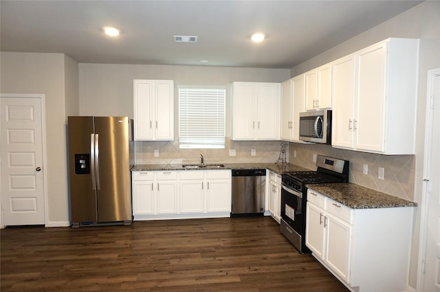 21930 King Heights Ln, Houston, TX 77073 - kitchen with stainless steel appliances, a sink, white cabinets, and recessed lighting