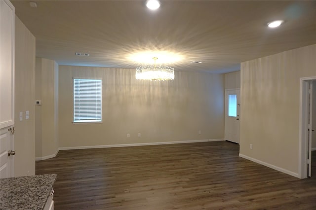 21930 King Heights Ln, Houston, TX 77073 - empty room featuring dark wood-style flooring, a chandelier, recessed lighting, and baseboards