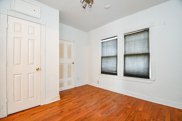 101 Emerald Ct, Houston, TX 77009 - unfurnished bedroom featuring wood finished floors and baseboards