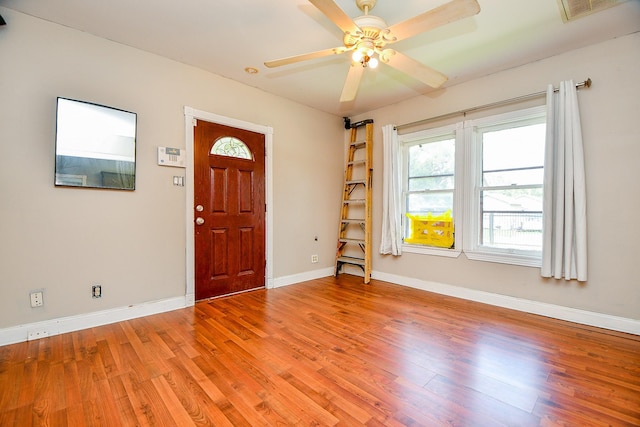 101 Emerald Ct, Houston, TX 77009 - entrance foyer with light wood-type flooring, baseboards, and a ceiling fan