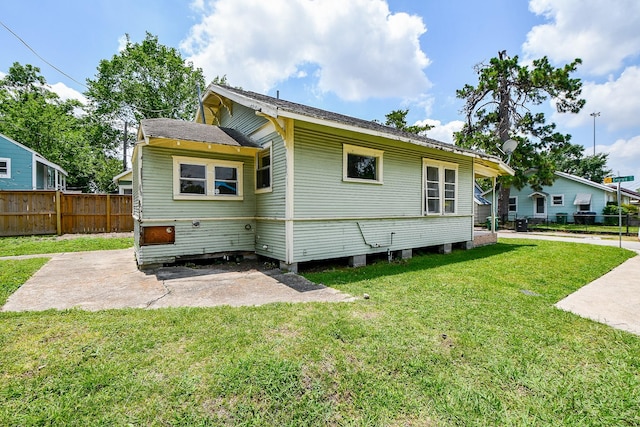 101 Emerald Ct, Houston, TX 77009 - back of house featuring a patio area and a shingled roof
