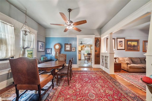 855 County Road 15, Damon, TX 77430 - dining space with a ceiling fan, wood finished floors, decorative columns, and baseboards