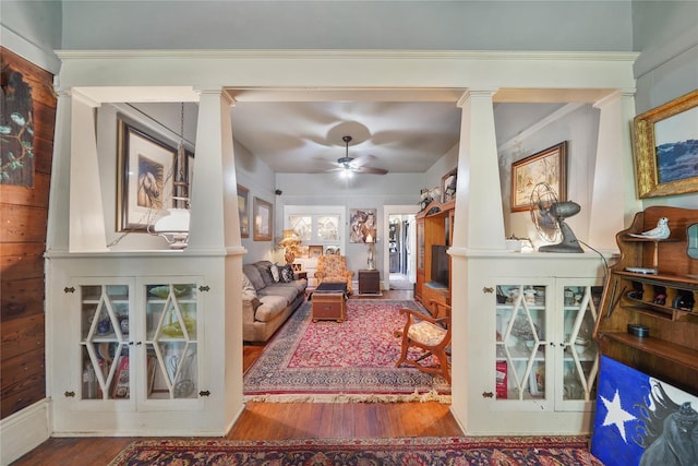 855 County Road 15, Damon, TX 77430 - living area featuring decorative columns, wood finished floors, and a ceiling fan