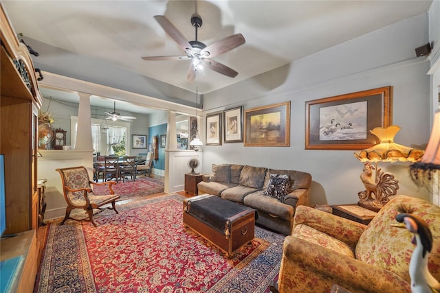 855 County Road 15, Damon, TX 77430 - living room featuring a ceiling fan, ornate columns, and wood finished floors
