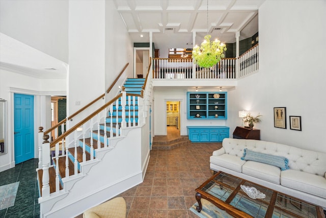 210 Victoria Way, Friendswood, TX 77546 - living area with a high ceiling, stairway, baseboards, coffered ceiling, and a chandelier