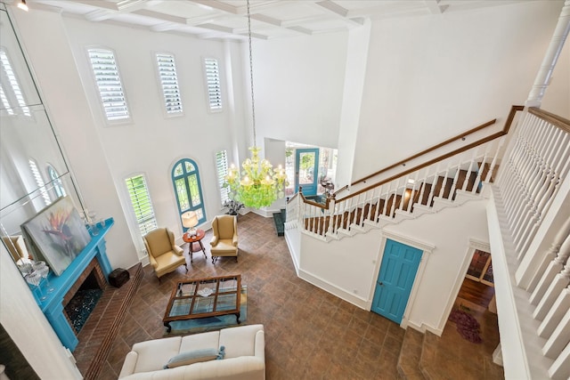 210 Victoria Way, Friendswood, TX 77546 - living room featuring a high ceiling, coffered ceiling, stairway, beamed ceiling, and baseboards