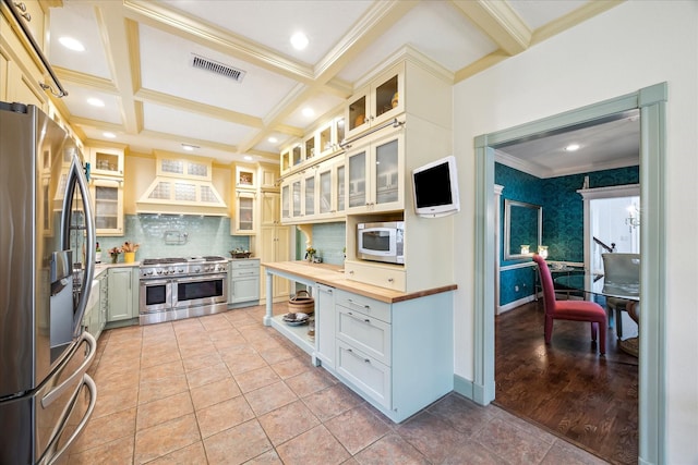 210 Victoria Way, Friendswood, TX 77546 - kitchen featuring stainless steel appliances, ornamental molding, wood counters, custom exhaust hood, and backsplash