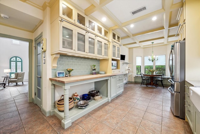 210 Victoria Way, Friendswood, TX 77546 - kitchen with freestanding refrigerator, coffered ceiling, beamed ceiling, decorative backsplash, and wood counters