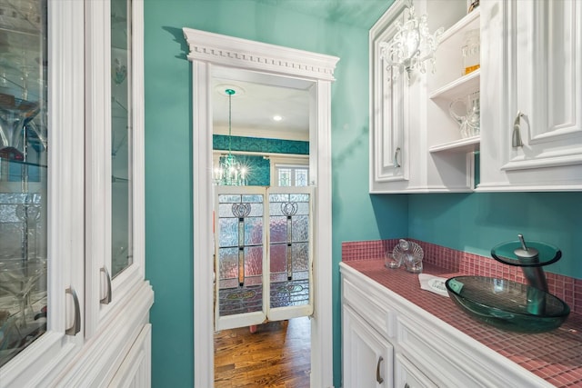 210 Victoria Way, Friendswood, TX 77546 - bar with dark wood-style floors and crown molding