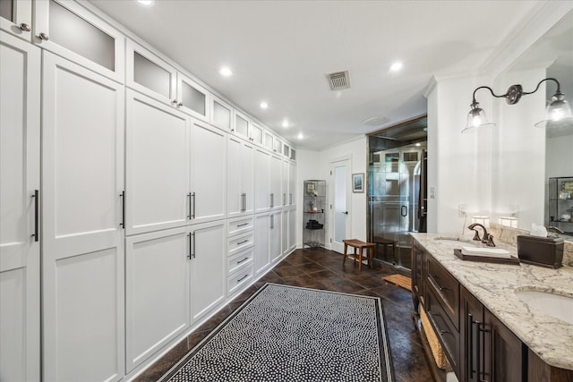 210 Victoria Way, Friendswood, TX 77546 - full bathroom with double vanity, recessed lighting, a shower with shower door, and ornamental molding