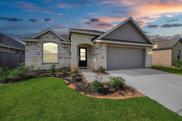 2947 Palominos Way, Conroe, TX 77301 - view of front facade featuring a garage, concrete driveway, and stone siding