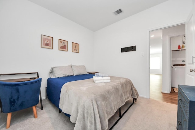 2947 Palominos Way, Conroe, TX 77301 - carpeted bedroom featuring washer / clothes dryer and baseboards