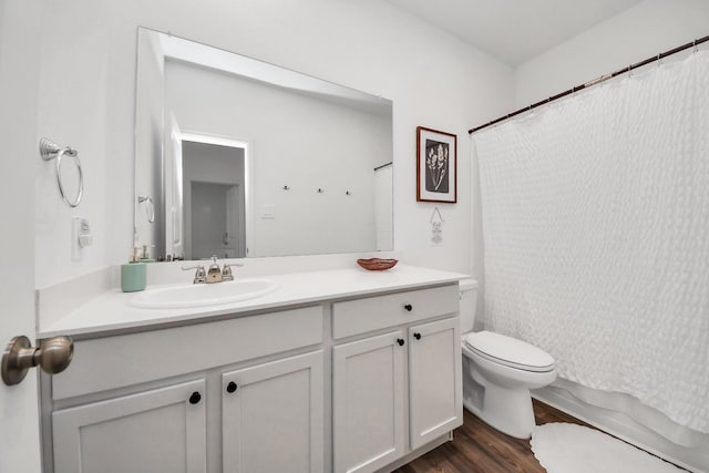 2947 Palominos Way, Conroe, TX 77301 - full bathroom featuring toilet, vanity, wood finished floors, and a shower with shower curtain