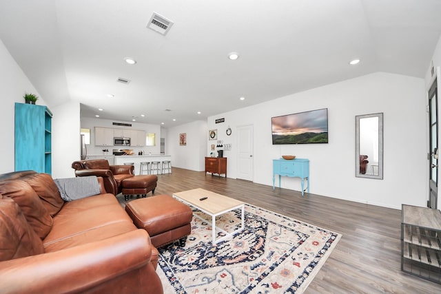 2947 Palominos Way, Conroe, TX 77301 - living area with light wood-style floors, vaulted ceiling, and recessed lighting