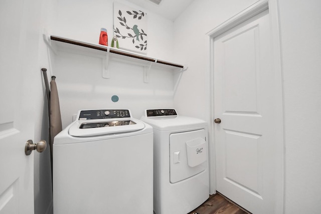 2947 Palominos Way, Conroe, TX 77301 - laundry area with independent washer and dryer and dark wood finished floors