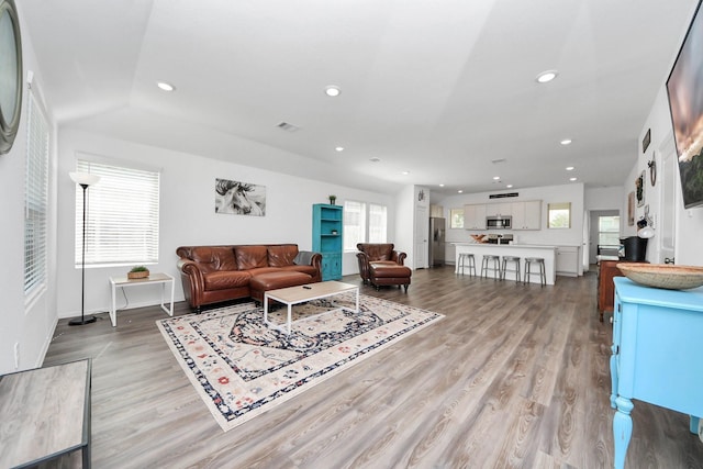 2947 Palominos Way, Conroe, TX 77301 - living area featuring plenty of natural light, light wood-style floors, recessed lighting, and baseboards