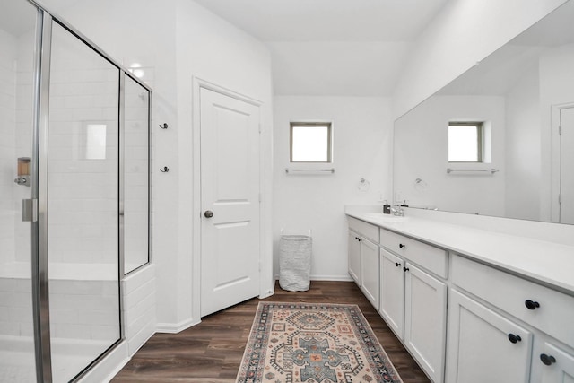 2947 Palominos Way, Conroe, TX 77301 - full bathroom featuring vanity, healthy amount of natural light, a shower stall, and wood finished floors