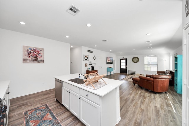 2947 Palominos Way, Conroe, TX 77301 - kitchen featuring dishwasher, light wood-style floors, light countertops, white cabinets, and recessed lighting