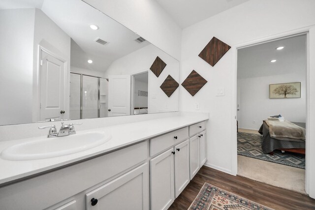 2947 Palominos Way, Conroe, TX 77301 - ensuite bathroom featuring vanity, wood finished floors, recessed lighting, a stall shower, and baseboards