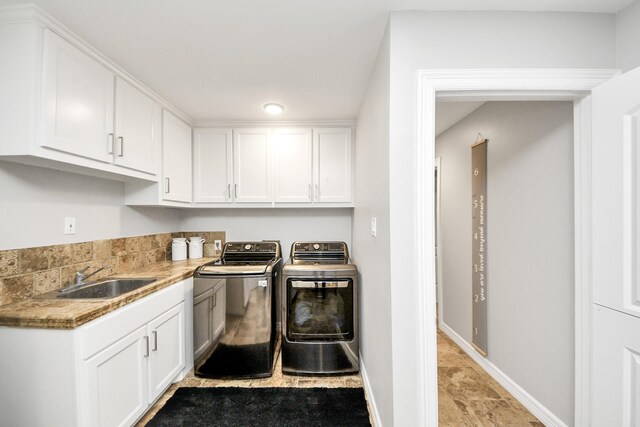 7519 Foster Creek Dr, Richmond, TX 77406 - washroom featuring washing machine and clothes dryer and cabinet space