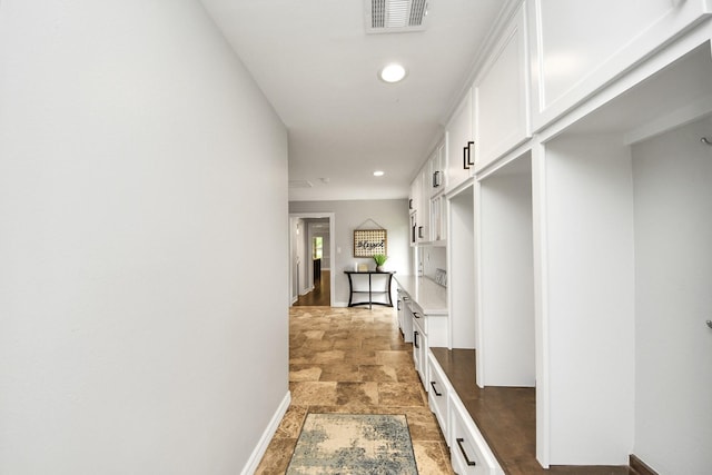 7519 Foster Creek Dr, Richmond, TX 77406 - mudroom featuring light stone finish floors and recessed lighting