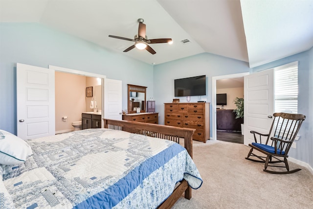 22107 Juniper Crossing Dr, New Caney, TX 77357 - carpeted bedroom featuring lofted ceiling, baseboards, and ensuite bath