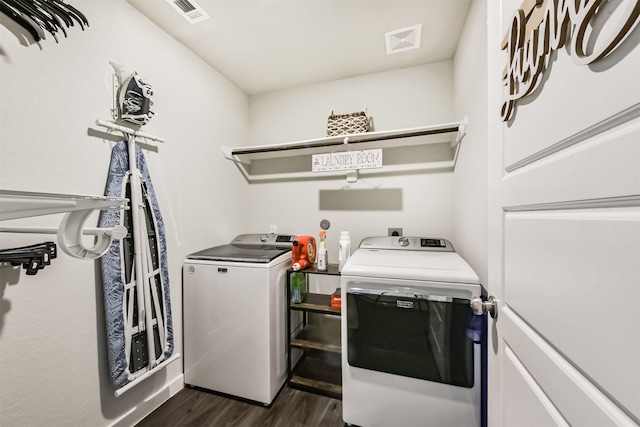 22107 Juniper Crossing Dr, New Caney, TX 77357 - laundry room with separate washer and dryer and dark wood-style floors