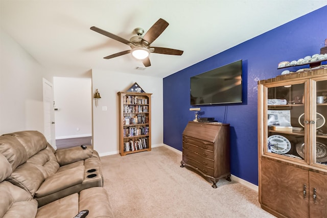 22107 Juniper Crossing Dr, New Caney, TX 77357 - living area with ceiling fan, carpet, and baseboards