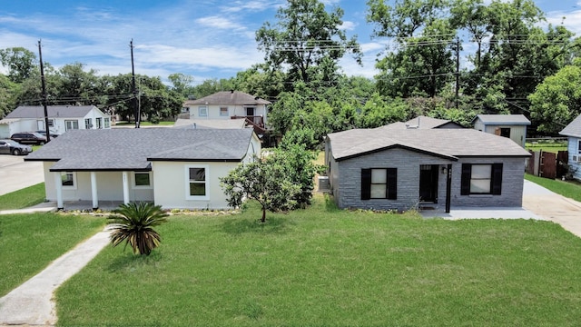 503 Schilling St, Baytown, TX 77520 - view of front of property featuring a front yard, stone siding, a shingled roof, a porch, and cooling unit