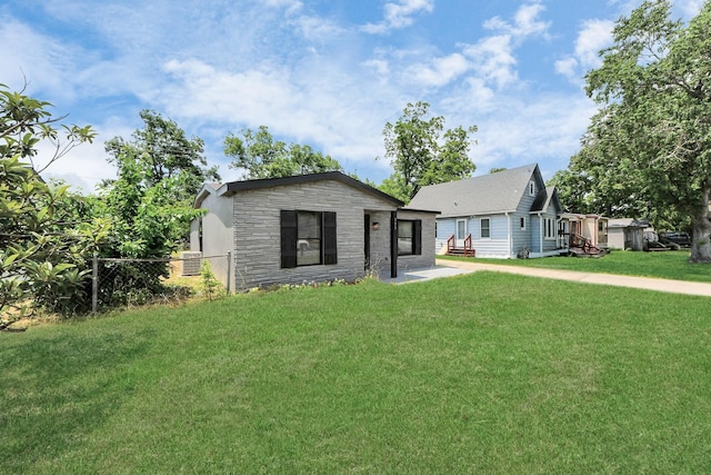 503 Schilling St, Baytown, TX 77520 - view of front of home featuring stone siding and cooling unit