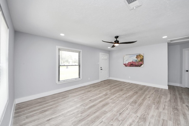 503 Schilling St, Baytown, TX 77520 - spare room featuring recessed lighting, light wood finished floors, ceiling fan, baseboards, and a textured ceiling