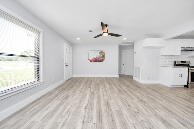 503 Schilling St, Baytown, TX 77520 - unfurnished living room featuring a ceiling fan, light wood-type flooring, recessed lighting, and baseboards