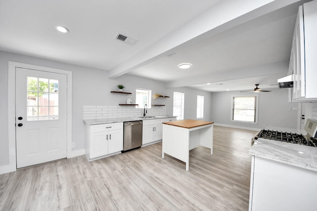 503 Schilling St, Baytown, TX 77520 - kitchen featuring dishwasher, open shelves, white cabinetry, butcher block counters, and healthy amount of natural light