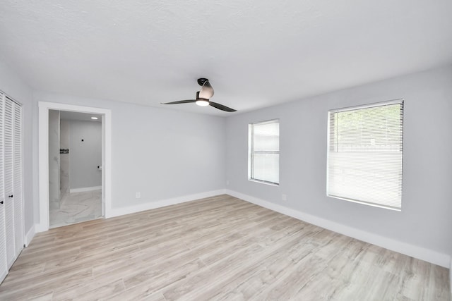 503 Schilling St, Baytown, TX 77520 - empty room featuring ceiling fan, baseboards, and light wood-style flooring