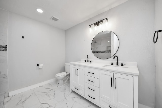 503 Schilling St, Baytown, TX 77520 - full bath featuring marble look tile flooring, double vanity, baseboards, toilet, and a marble finish shower