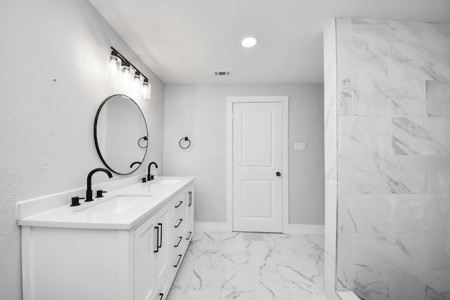 503 Schilling St, Baytown, TX 77520 - full bath featuring double vanity, marble finish flooring, recessed lighting, and baseboards
