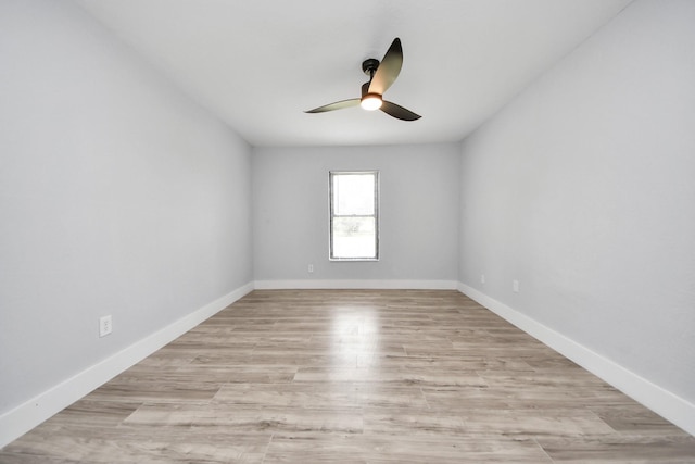 503 Schilling St, Baytown, TX 77520 - empty room with a ceiling fan, light wood-style flooring, and baseboards