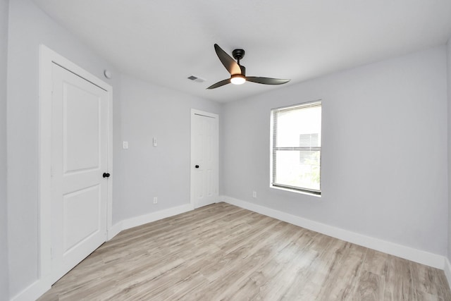 503 Schilling St, Baytown, TX 77520 - unfurnished bedroom featuring light wood-style floors, baseboards, a closet, and ceiling fan