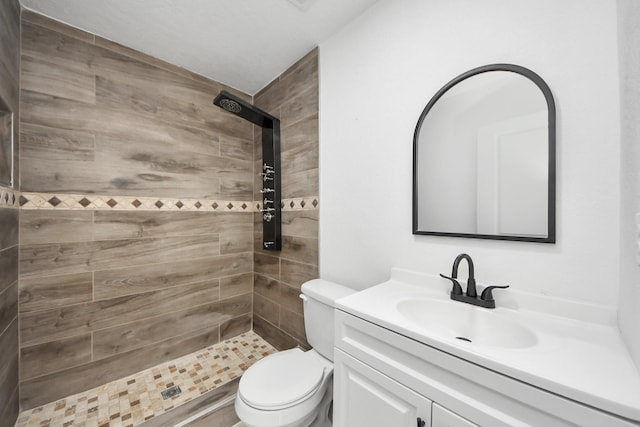 503 Schilling St, Baytown, TX 77520 - bathroom featuring vanity, toilet, and a tile shower