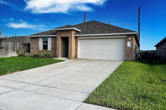 22911 San Giorgio Ct, Katy, TX 77449 - single story home with brick siding, an attached garage, driveway, central AC unit, and roof with shingles