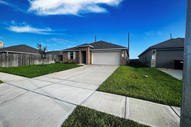 22911 San Giorgio Ct, Katy, TX 77449 - ranch-style house with brick siding, an attached garage, concrete driveway, and a shingled roof
