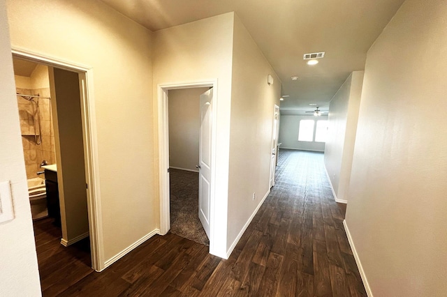 22911 San Giorgio Ct, Katy, TX 77449 - corridor with dark wood-style floors and baseboards