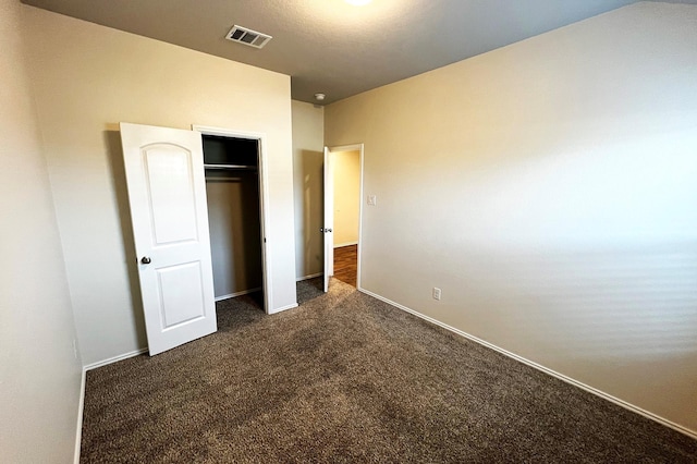 22911 San Giorgio Ct, Katy, TX 77449 - unfurnished bedroom featuring dark colored carpet, baseboards, and a closet