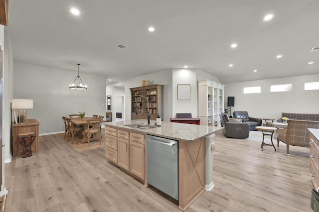 9203 White Tail Dr, Conroe, TX 77303 - kitchen featuring stainless steel dishwasher, light wood-type flooring, recessed lighting, light stone counters, and open floor plan