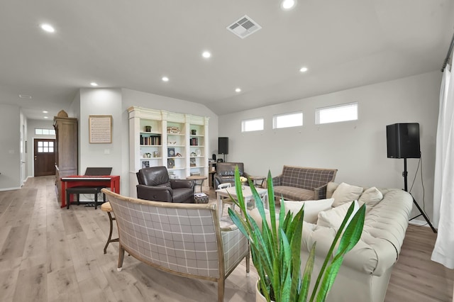 9203 White Tail Dr, Conroe, TX 77303 - living area with light wood-style floors, recessed lighting, and lofted ceiling