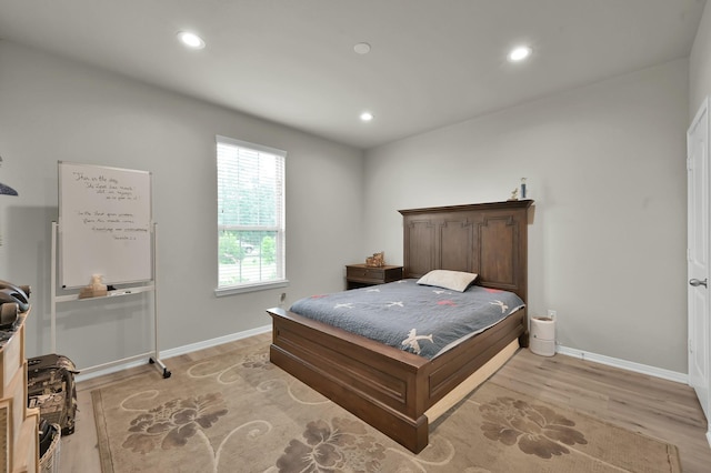 9203 White Tail Dr, Conroe, TX 77303 - bedroom featuring recessed lighting and light wood-style flooring