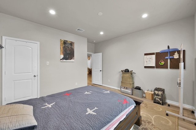 9203 White Tail Dr, Conroe, TX 77303 - bedroom with recessed lighting and wood finished floors